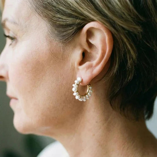 Vintage earrings with white pearl.