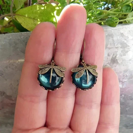 Ball earrings with dragonfly in antique gold.