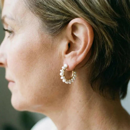 Vintage earrings with white pearl.