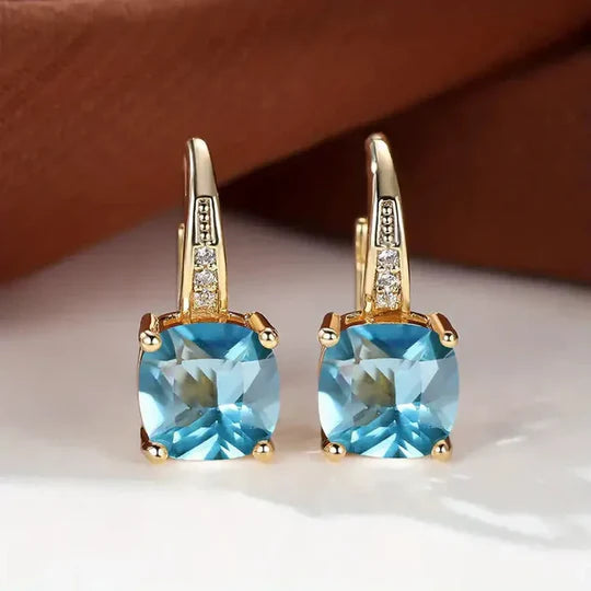 Gold hoop Earrings with mystery Stones.
