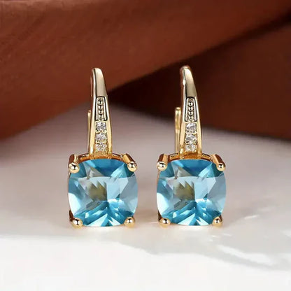Gold hoop Earrings with mystery Stones.