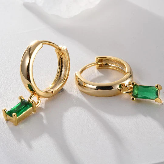 Elegant Louise earrings with emeralds.