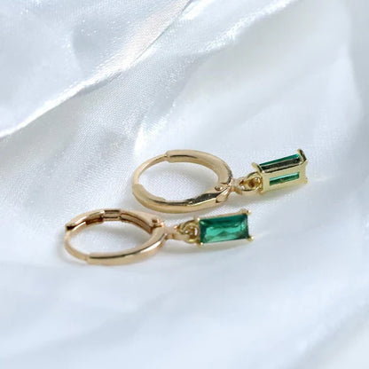 Elegant Louise earrings with emeralds.
