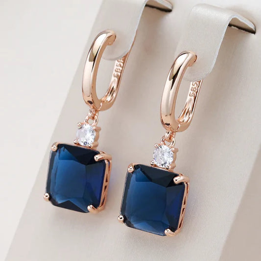 Teardrop earrings with dark blue crystal.